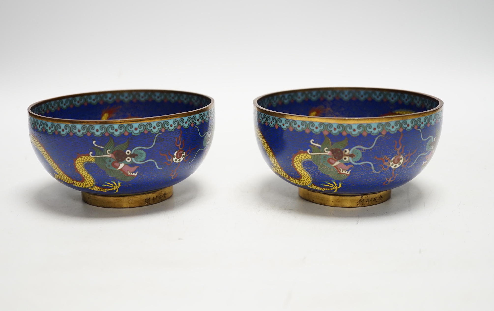 A pair of Chinese cloisonné enamel bowls decorated with dragons, c.1890-1910, signed lao tian li zhi, 11cm in diameter